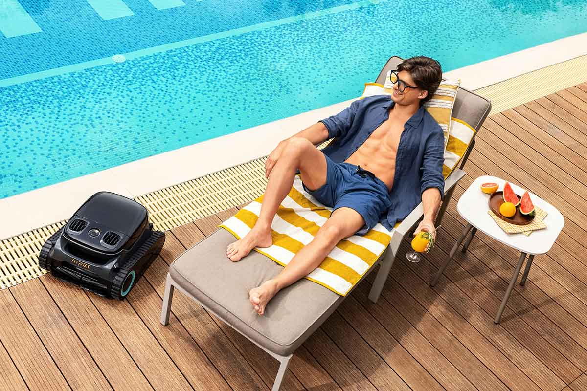 Automatic swimming pool cleaner removing debris from a residential pool