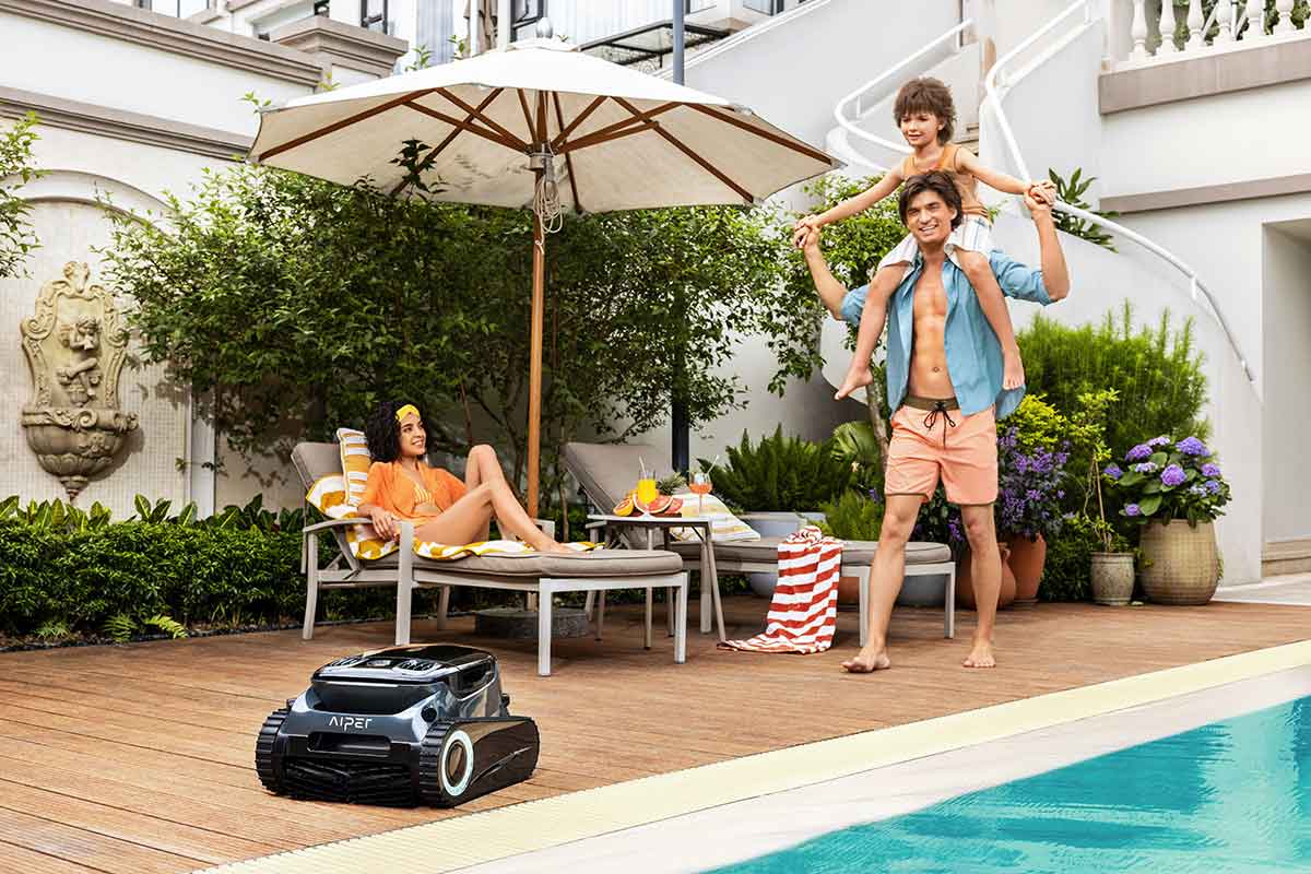 Cordless swimming pool cleaner working across a residential pool floor