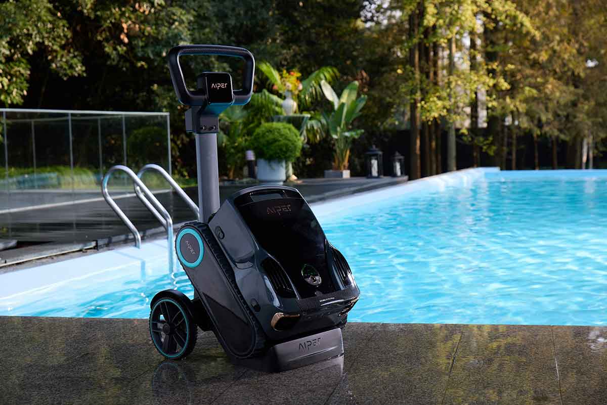 Robotic pool cleaner moving across a swimming pool surface