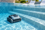 Can Robotic Pool Cleaners Handle Steps and Tanning Ledges? Models and Limits